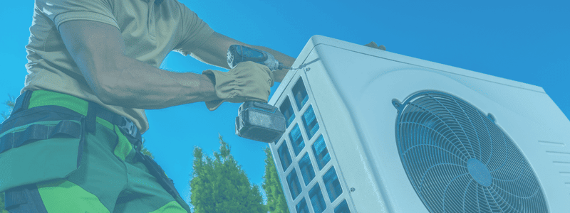 HVAC technician repairing AC
